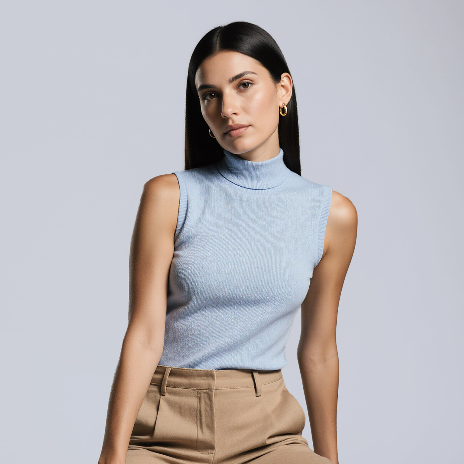 Woman wearing light blue sleeveless top and tan trousers near Indian Creek dry cleaner